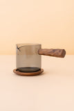Glass pot with handle and saucer